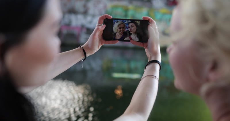 two women posing for a selfie 