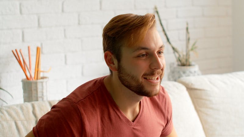 man smiling and cheering with intense excitement