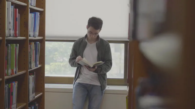 Man, Books, Library, Book by Director Young – Stock Footage | Artlist