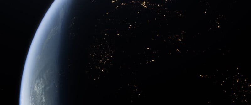 Sun rising over earth in space CGI