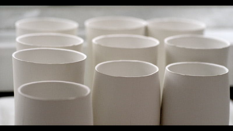 white ceramic vases on display 