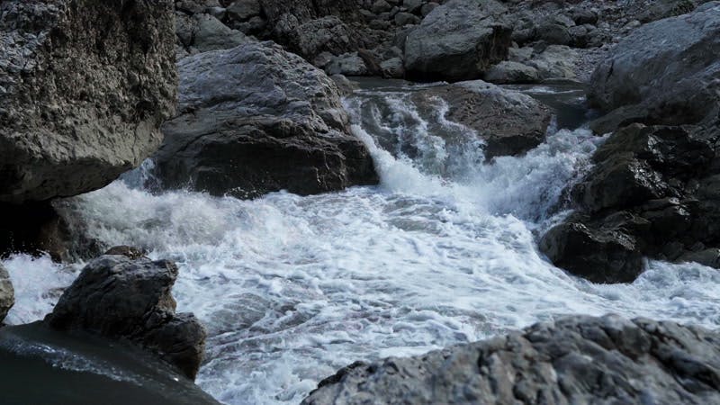 white water by the rocks in the river 