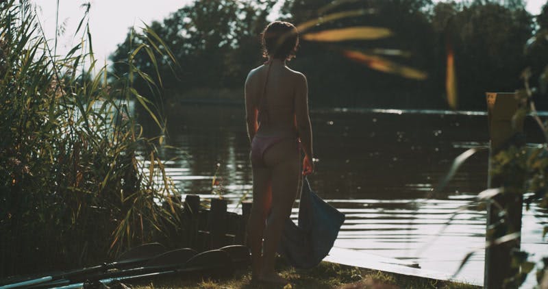 woman-lake-bathing-suits-towel