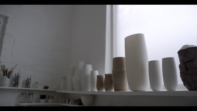 various sizes of ceramic vases on display  