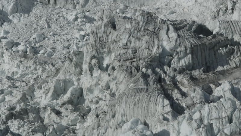dark colored ice in a glacier 