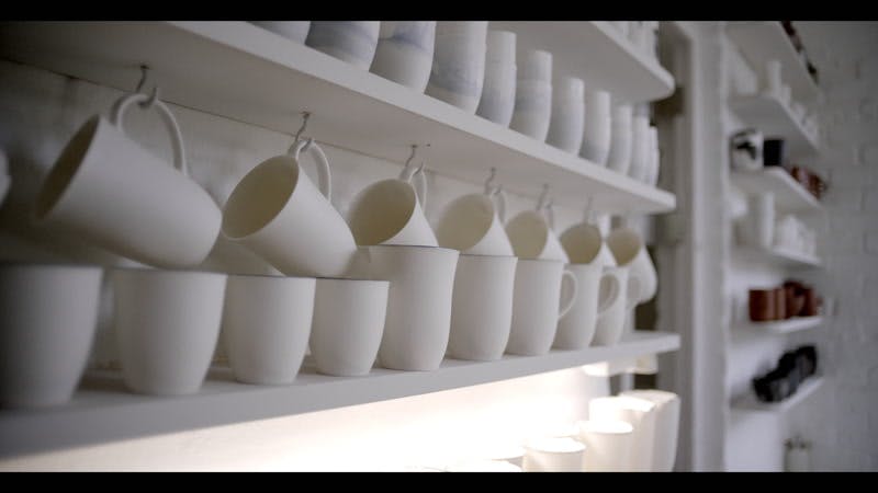 ceramic dishes displayed on a shelf 