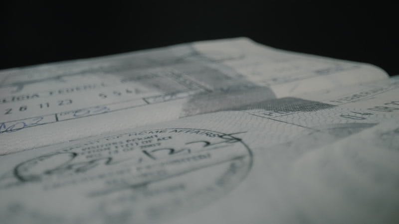 A U.S. passport open with visa stamps closeup